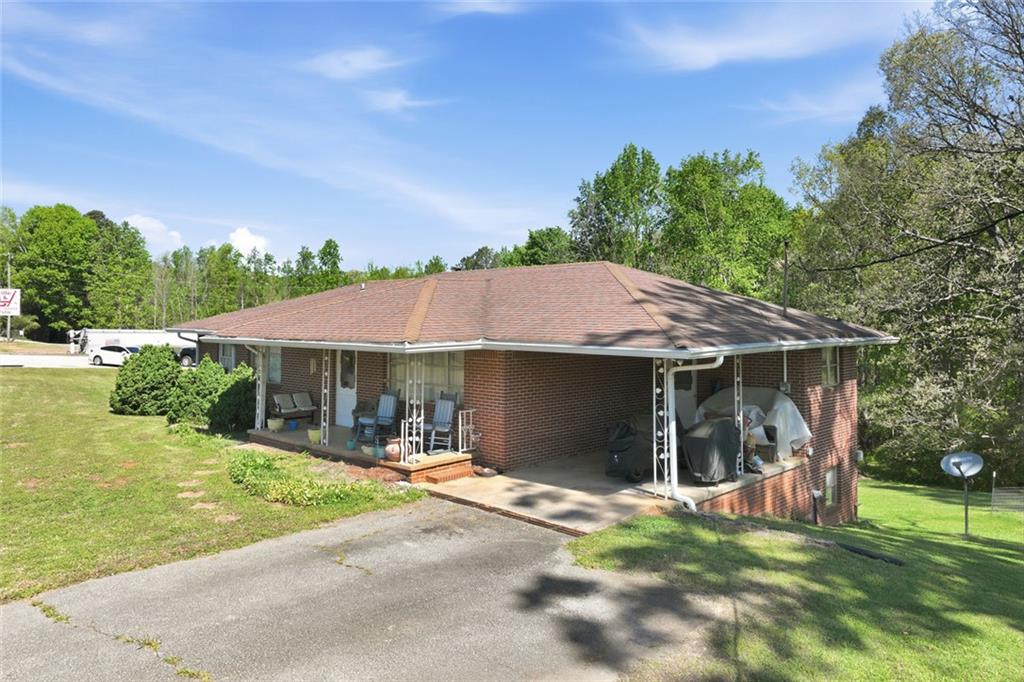 2475 Athens Highway Gainesville, GA 30507 - Photo 5 of 18 a house view with a sitting space and garden