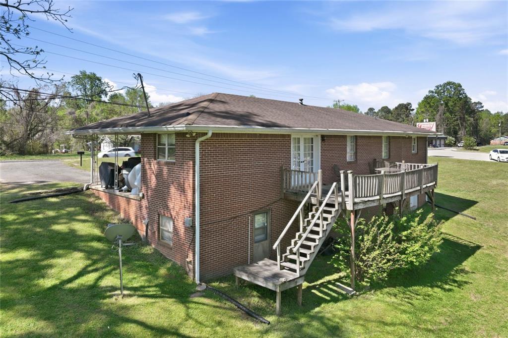 2475 Athens Highway Gainesville, GA 30507 - Photo 7 of 18 a front view of a house with a garden