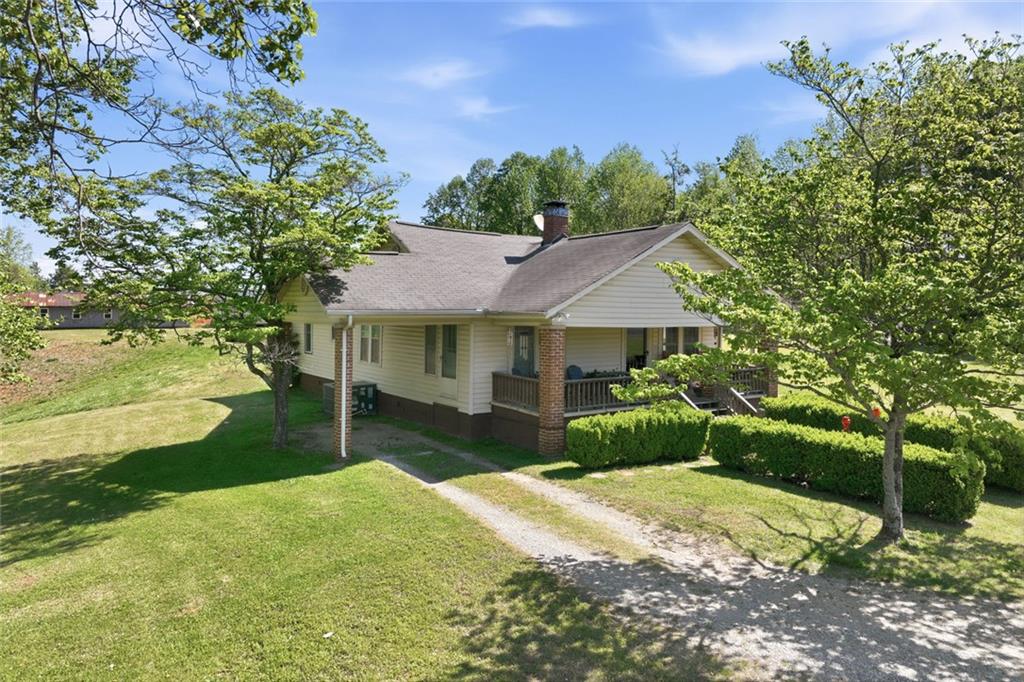 2475 Athens Highway Gainesville, GA 30507 - Photo 8 of 18 a front view of a house with a yard