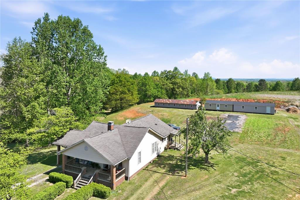 2475 Athens Highway Gainesville, GA 30507 - Photo 9 of 18 a view of a swimming pool with a yard and plants