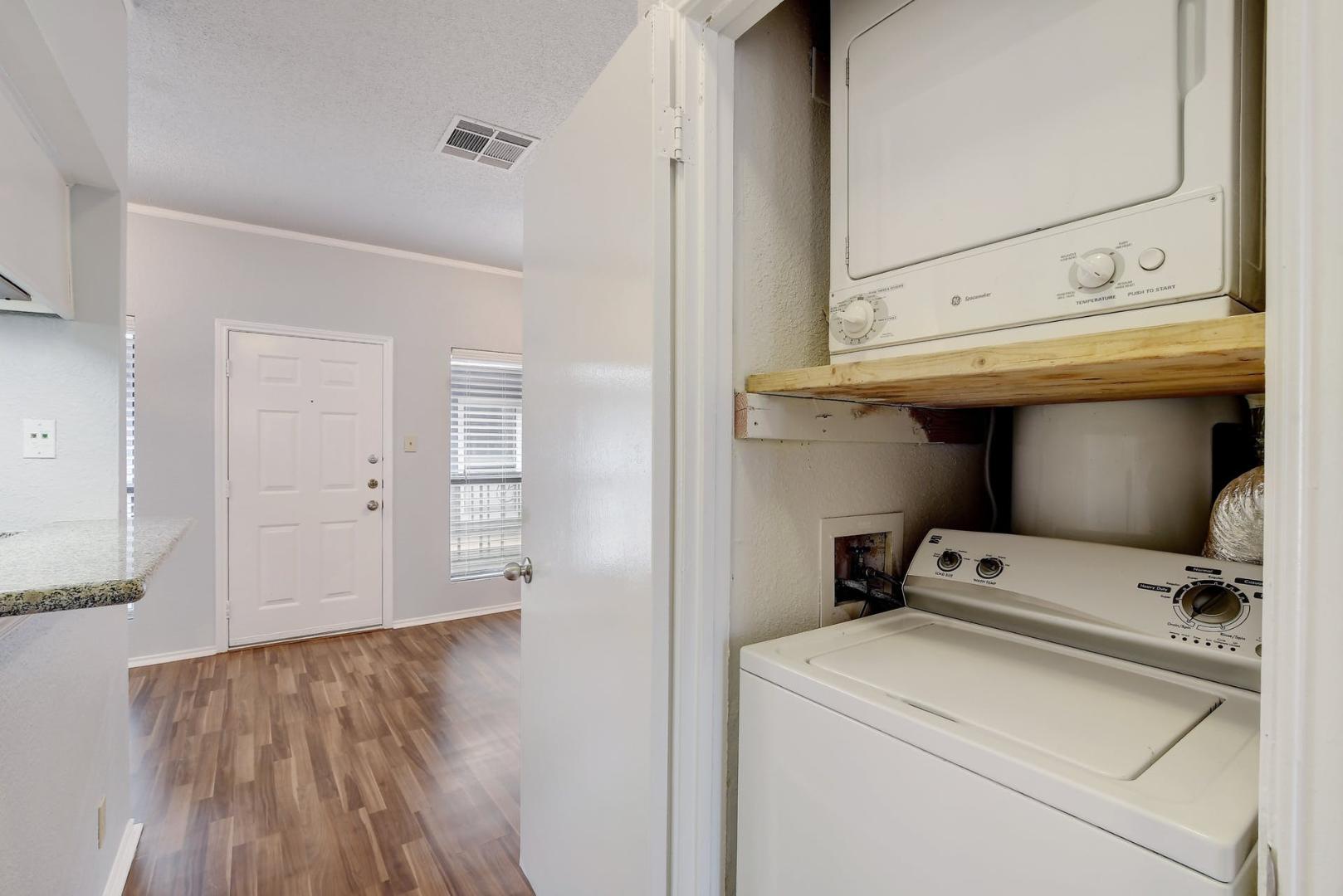 2804 Rio Grande Street, Unit 310 Austin, TX 78705 - Photo 19 of 22 Conveniently tucked away, this stacked laundry closet optimizes space and efficiency.
