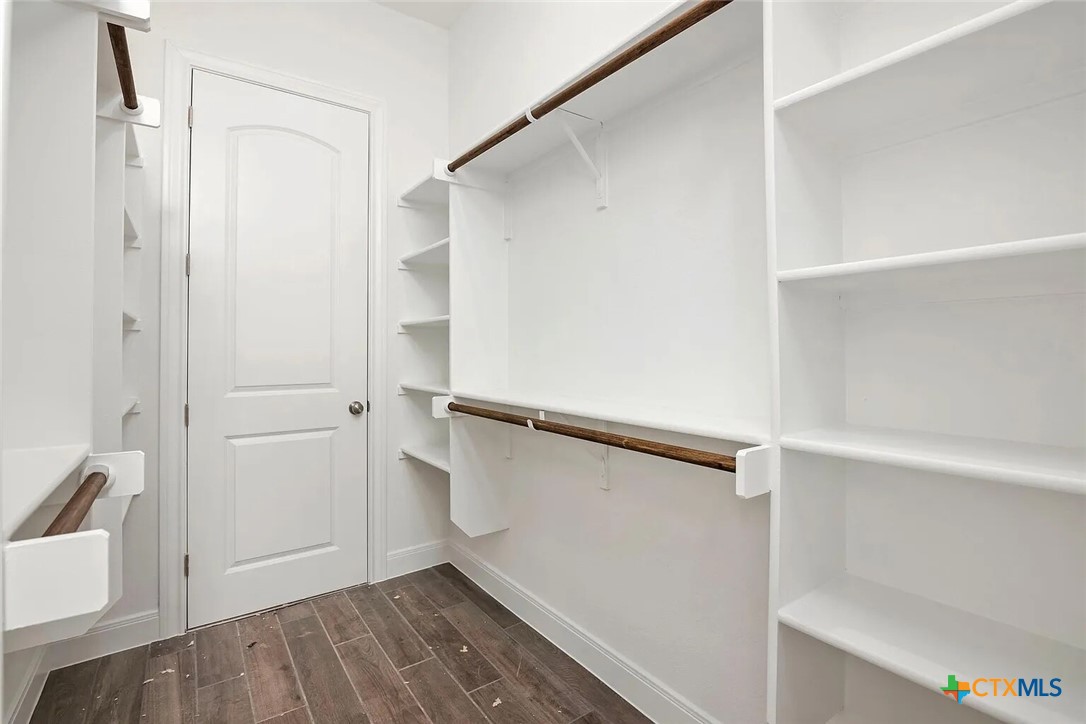 155 North Rip Ford Road, Unit B Spring Branch, TX 78070 - Photo 13 of 17 a view of walk in closet with empty racks