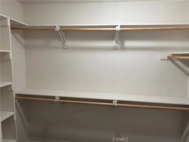 a white toilet sitting next to a shower