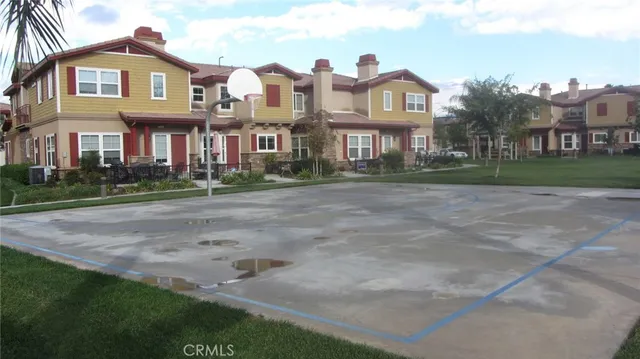 a front view of a brick house with a yard