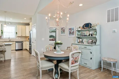 a view of a deck with wooden floor and fence with a floor to ceiling window