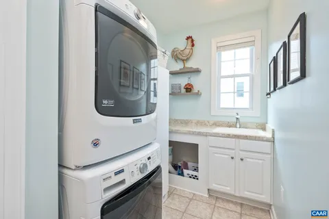 a hallway with furniture and wooden floor