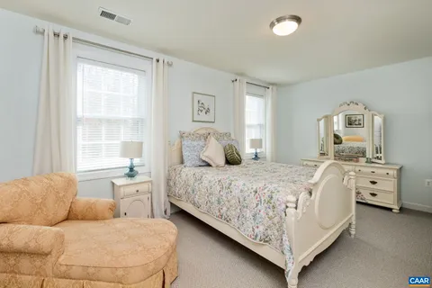 a bathroom with a sink toilet and a mirror