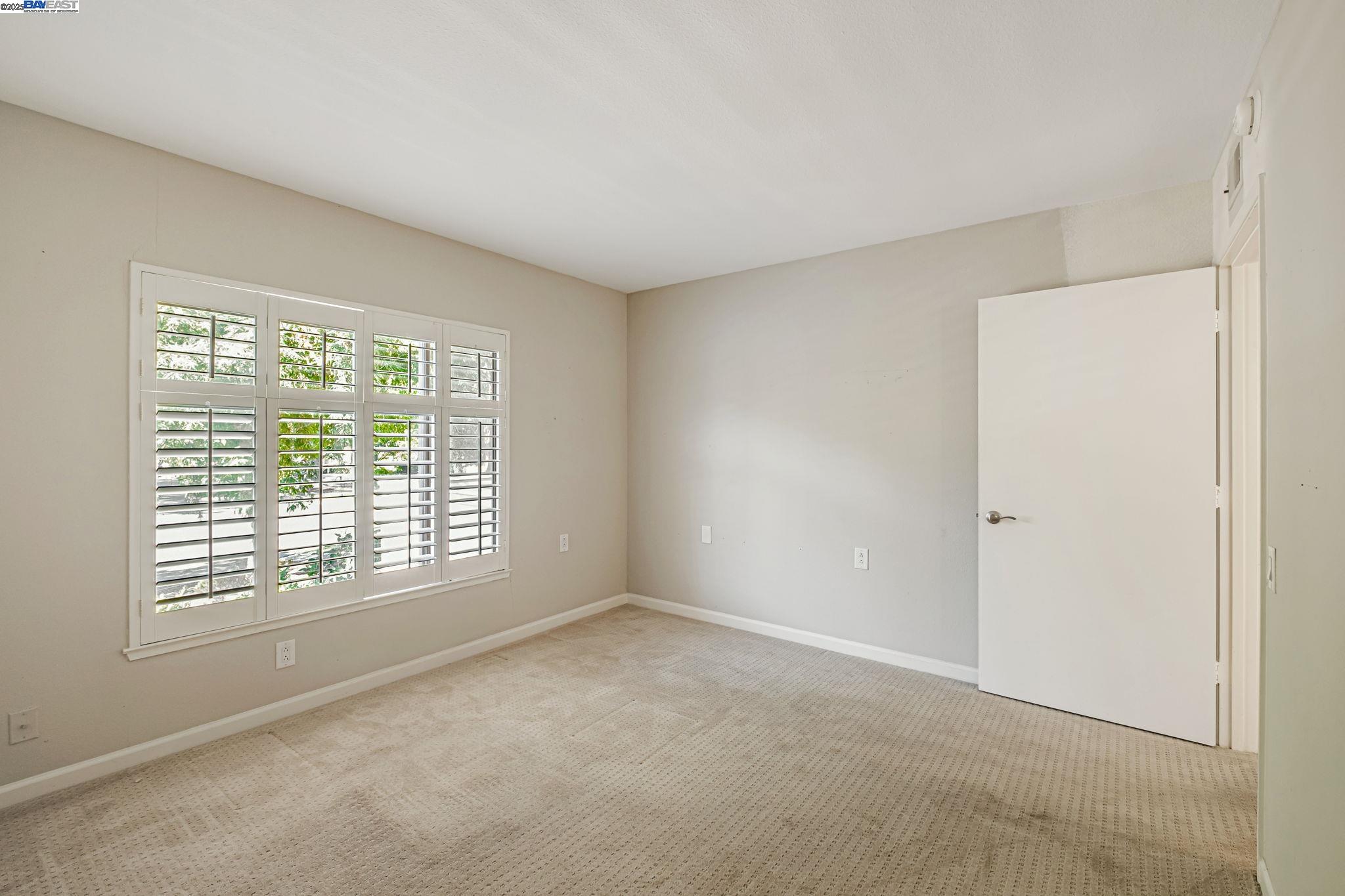 1400 Golden Rain Road, Unit 3 Walnut Creek, CA 94595 - Photo 20 of 29 a view of an empty room with a window