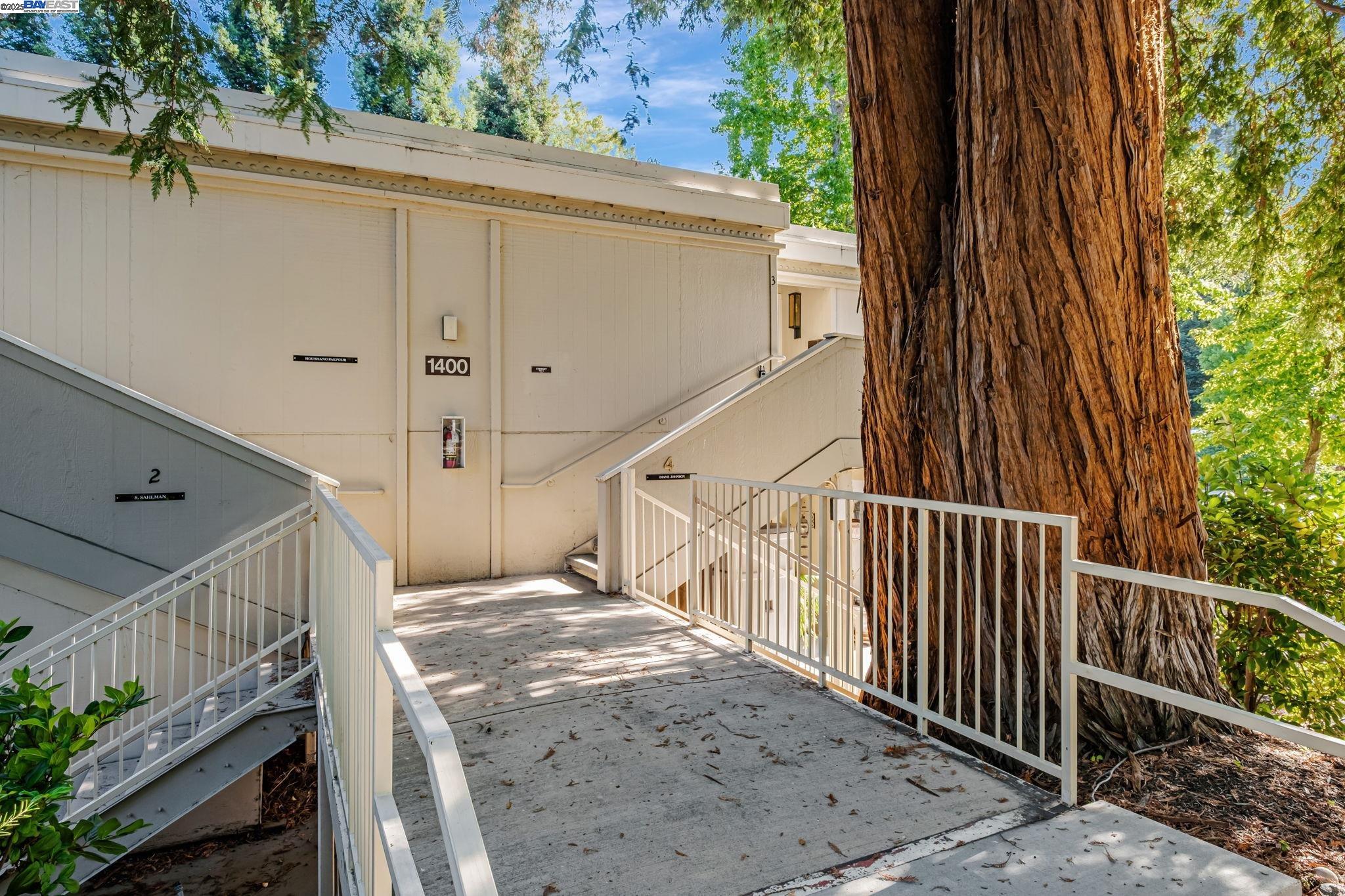 1400 Golden Rain Road, Unit 3 Walnut Creek, CA 94595 - Photo 3 of 29 a view of a balcony with wooden floor and fence
