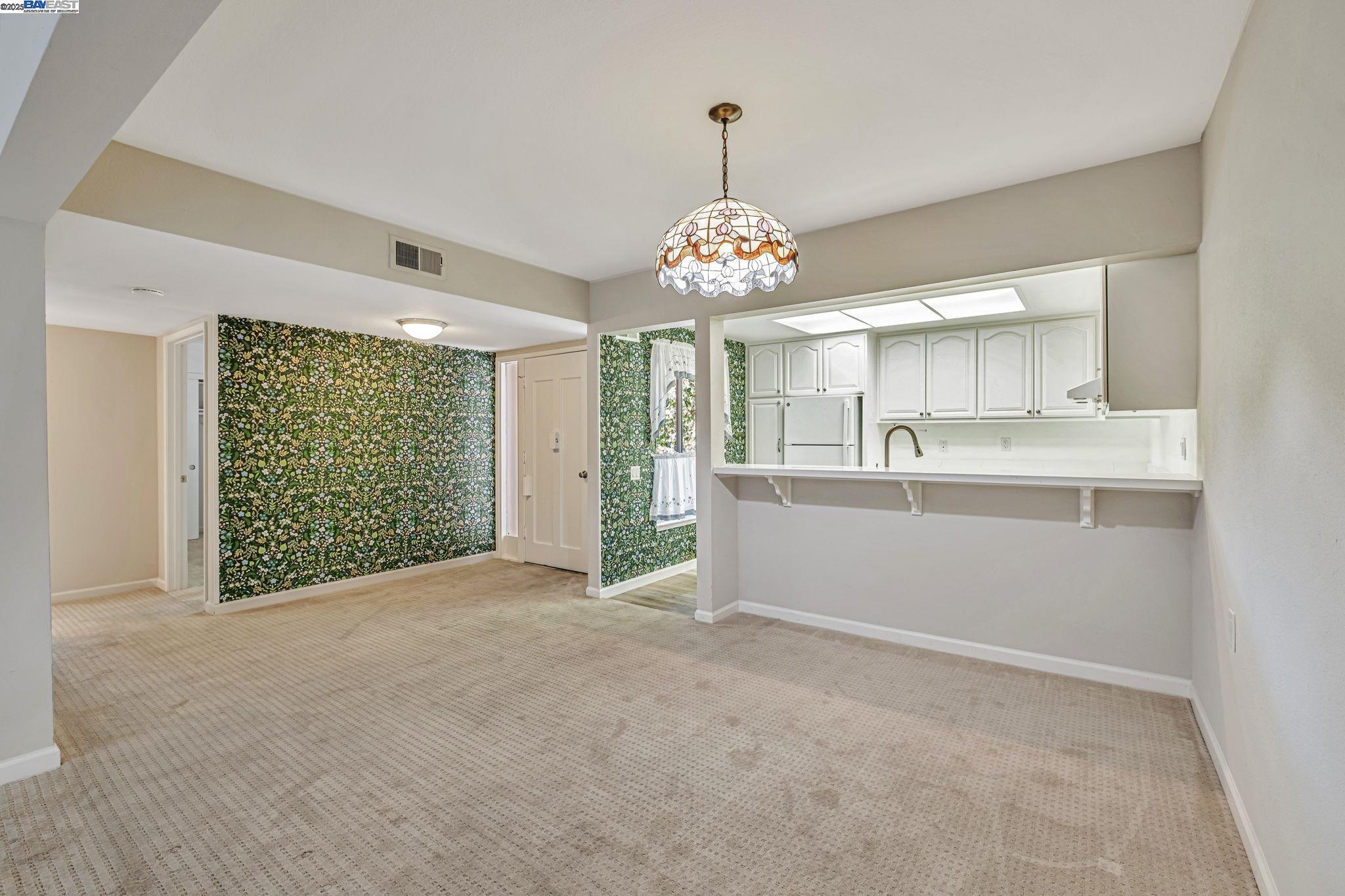 1400 Golden Rain Road, Unit 3 Walnut Creek, CA 94595 - Photo 9 of 29 a view of a kitchen with large windows