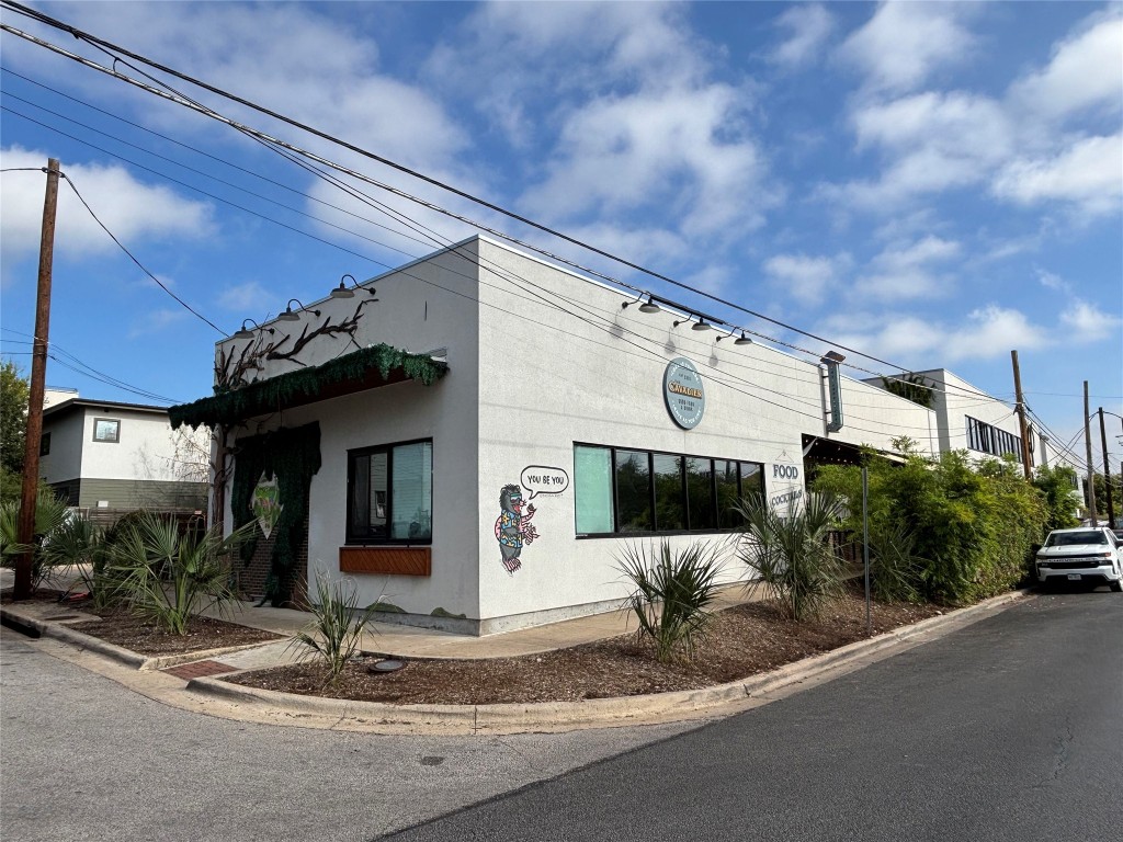 2307 Coronado Street Austin, TX 78702 - Photo 12 of 17 a front view of a house with yard
