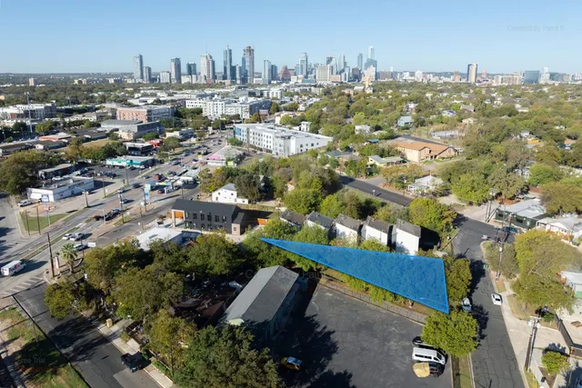 an aerial view of a city with lots of residential buildings