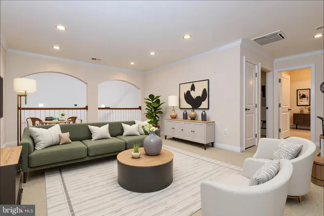 a living room with furniture and a rug