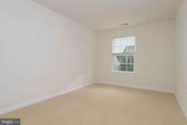 a view of a small space with racks on the wall