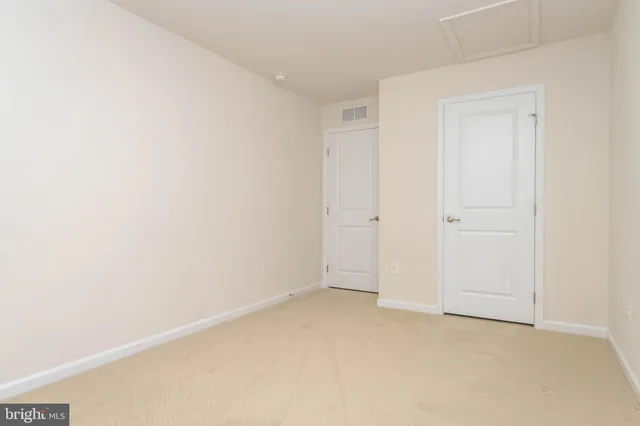 a living room with furniture a chandelier and a fireplace