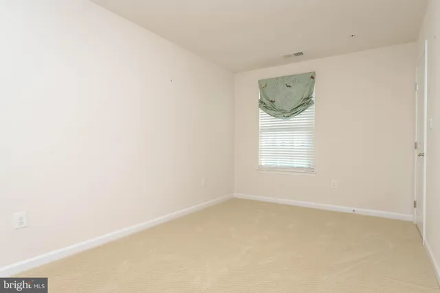 a kitchen with a sink cabinets and wooden floor