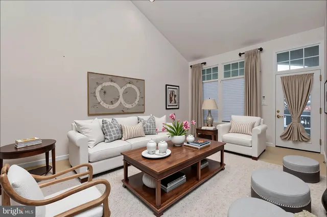 a kitchen with granite countertop a sink stainless steel appliances and white cabinets