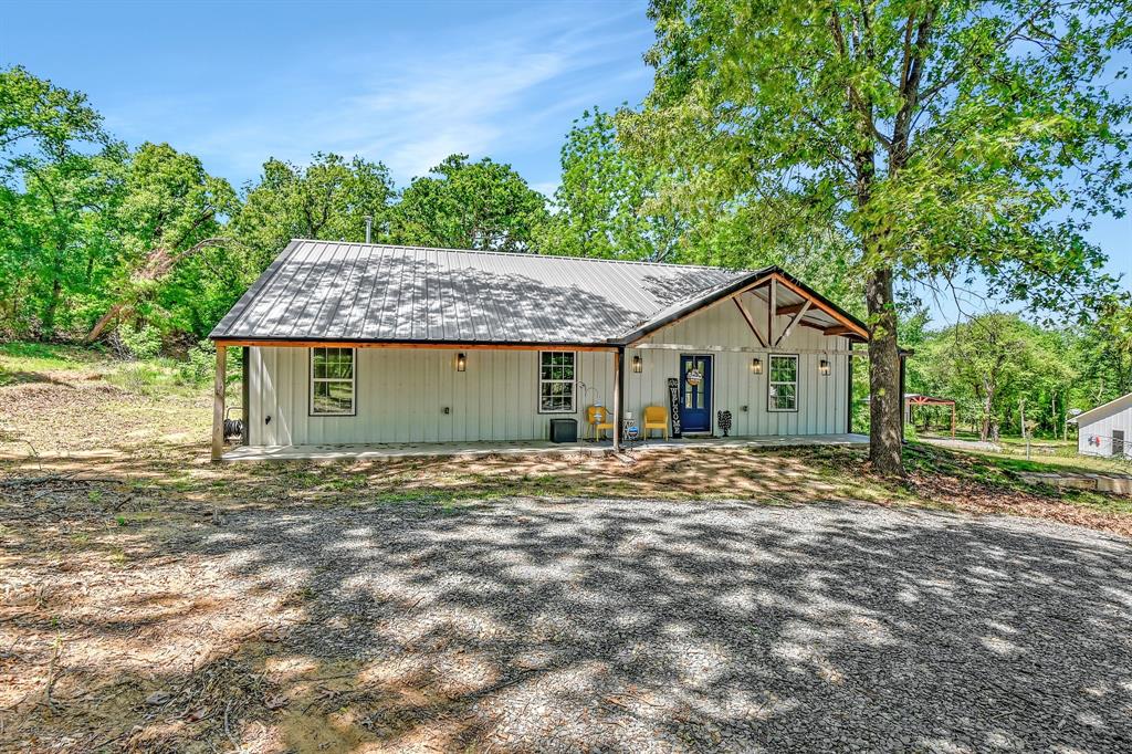 1685 Fleming Road Bells, TX 75414 - Photo 1 of 1 a view of a house with a yard and large tree