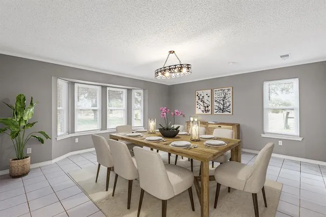 a view of a dining room with furniture and window