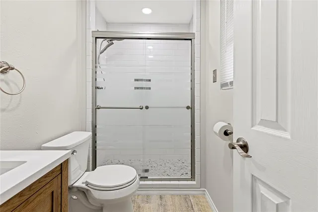 a front view of a house with a garden and deck