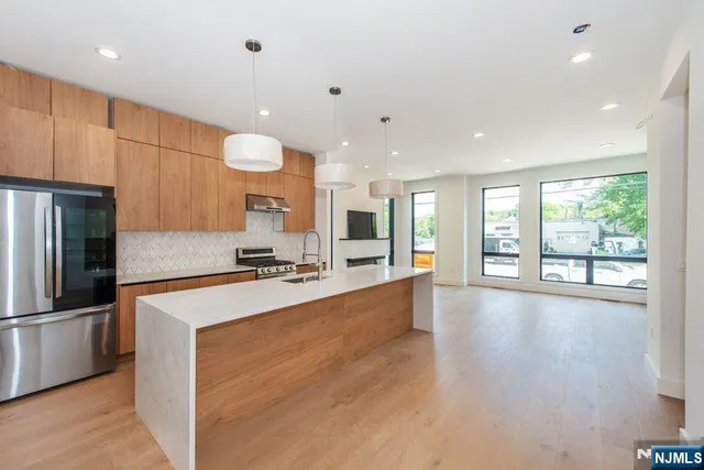 a white bath tub sitting next to a shower