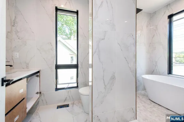 an aerial view of residential house with outdoor space and swimming pool