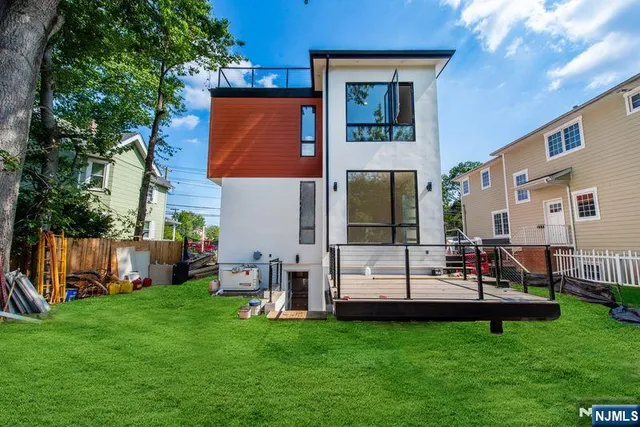 a kitchen with kitchen island a stove a sink and a refrigerator