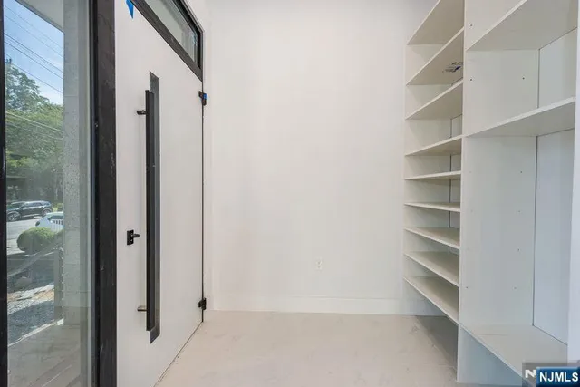 a view of a livingroom with furniture and a window