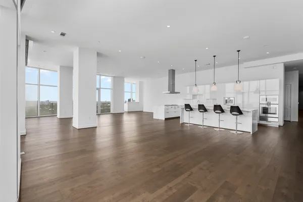 a view of kitchen with furniture and wooden floor