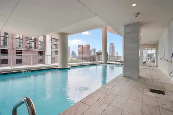 a view of a living room with kitchen