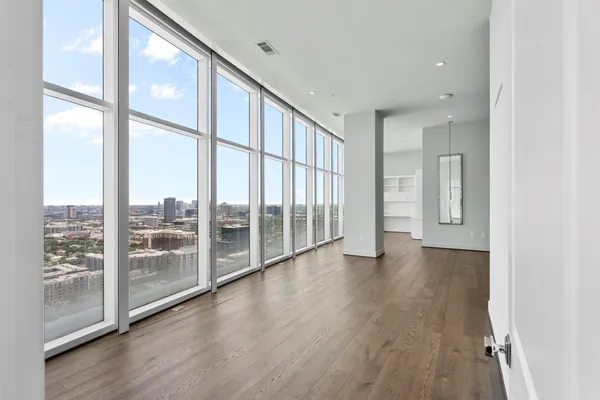 a view of an entryway with wooden floor