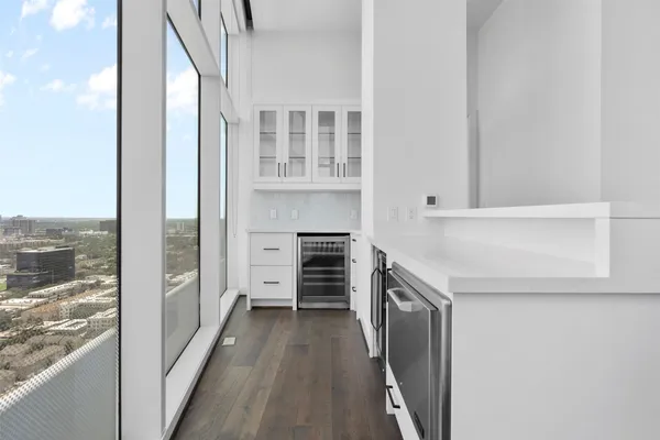 a kitchen with granite countertop a stove and a refrigerator