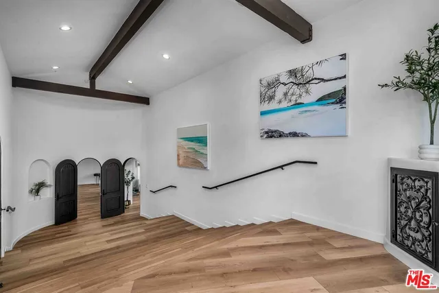 a view of a bedroom with bed and dresser