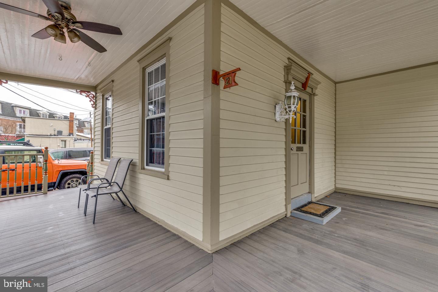21 Ellis Street Haddonfield, NJ 08033 - Photo 4 of 23 a view of a porch with a table and chairs with wooden floor and fence