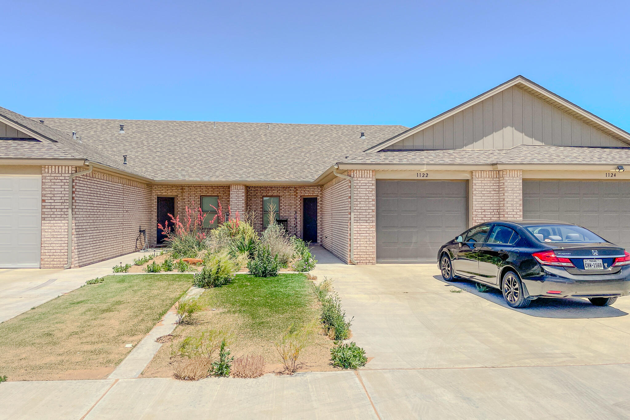 a car parked in front of a house