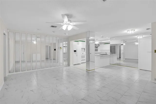 a view of a livingroom with a ceiling fan