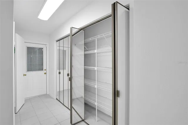 a bathroom with a shower and closet