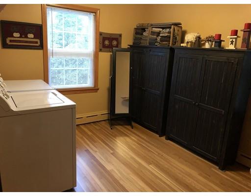 512 Hardwick Road Hardwick, MA 01031 - Photo 20 of 41 a view of a kitchen with refrigerator and wooden floor