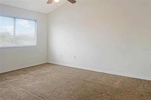 an empty room with a empty space and a window