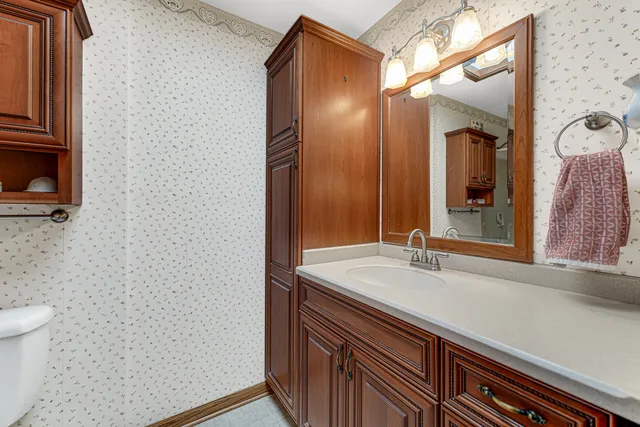 a bathroom with a sink and a mirror