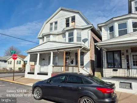 a front view of a house with parking