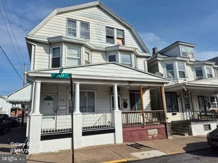 a front view of a house with a porch