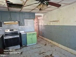 a kitchen with a stove and a refrigerator