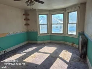 a view of a room that has a window