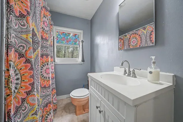 a bedroom with a bed and flat screen tv