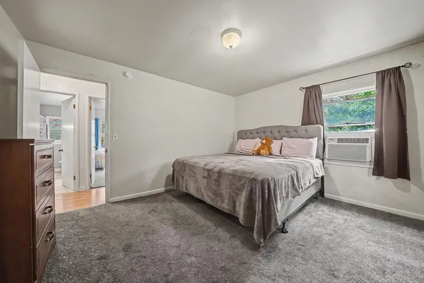 a bedroom with a bed and a closet
