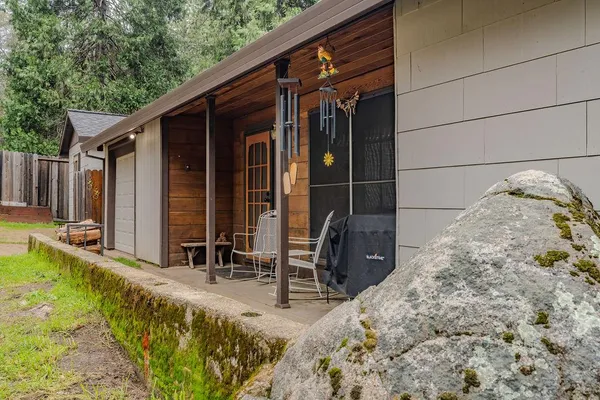 a view of a backyard with sitting area