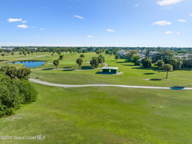 a view of a golf course with a houses