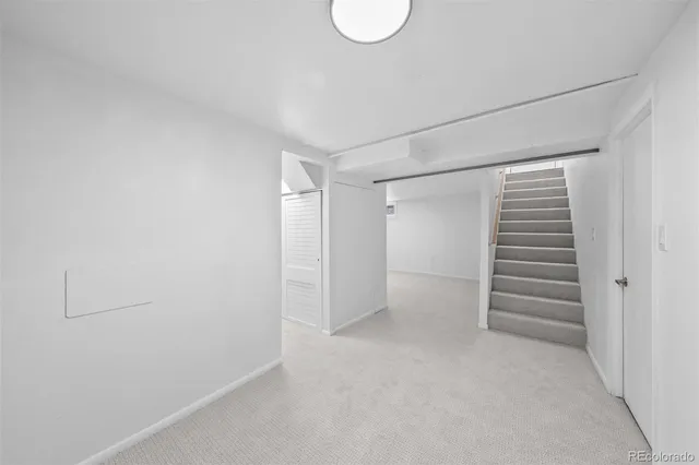 a view of walk in closet with stairs