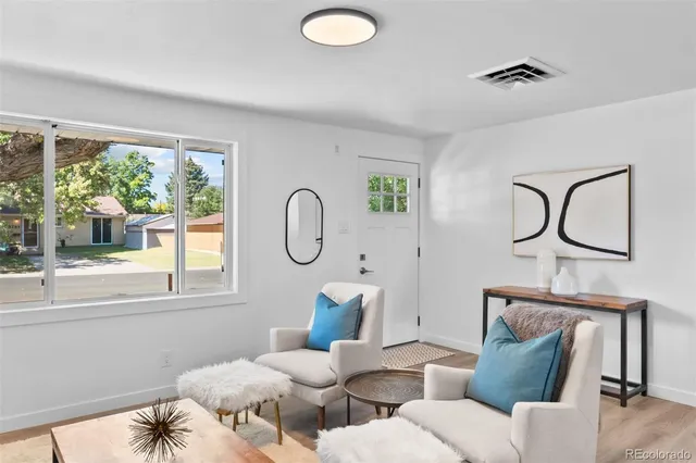a living room with furniture and a window
